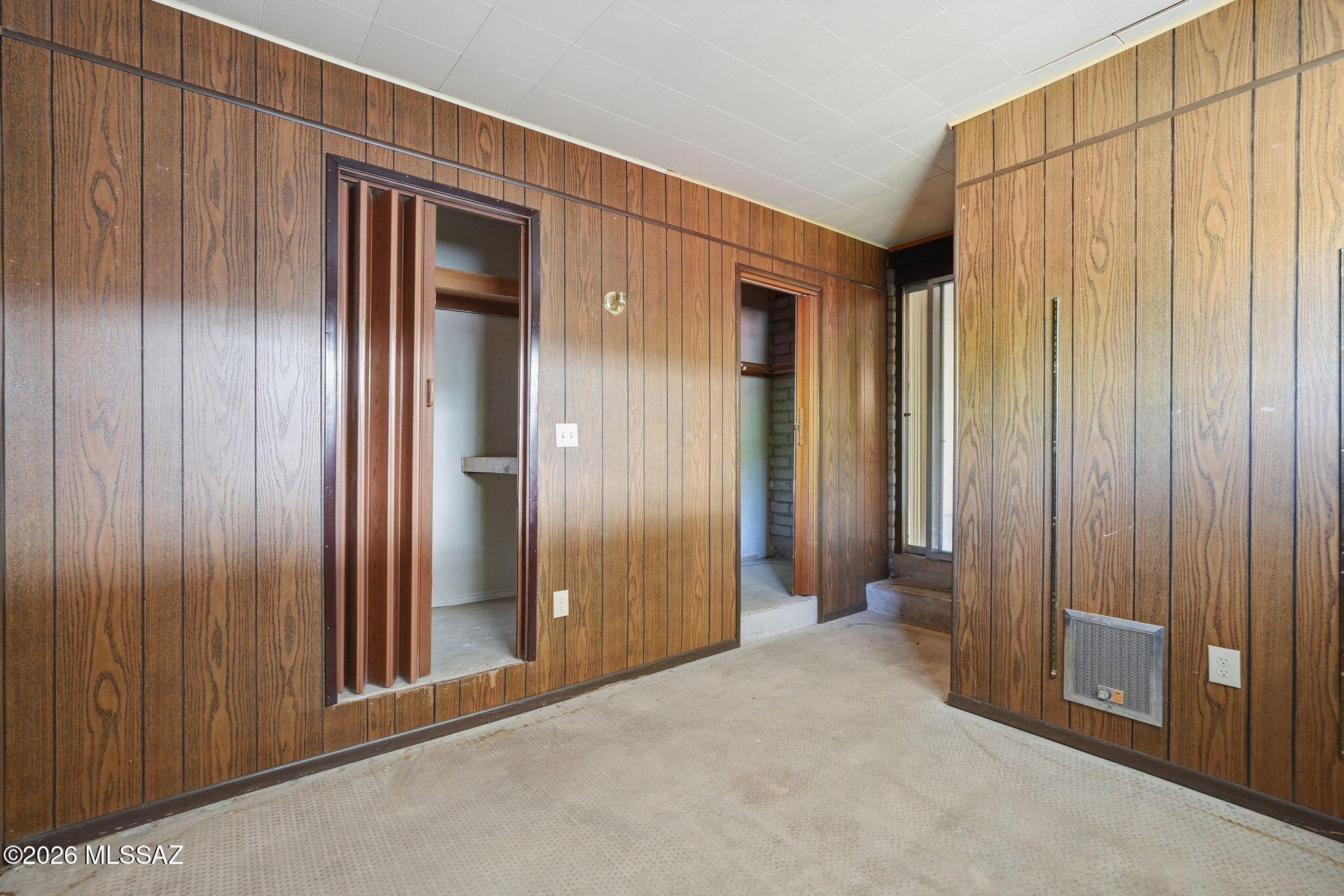 1831 West Dominy Road Tucson, AZ 85713 - Photo 27 of 38 Bonus Room has 2 closets, wall heater, wall AC, window & ext. door!