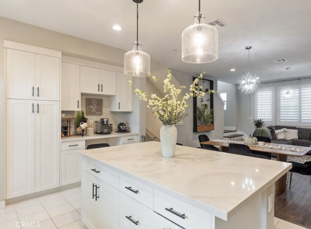 2111 Copper Walk Gardena, CA 90249 - Photo 12 of 33 a large kitchen with kitchen island a large counter space and stainless steel appliances