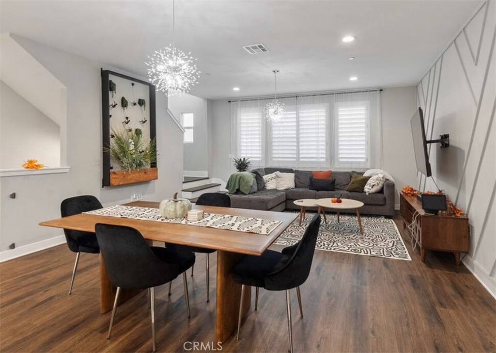 2111 Copper Walk Gardena, CA 90249 - Photo 13 of 33 a view of a dining room with furniture and wooden floor