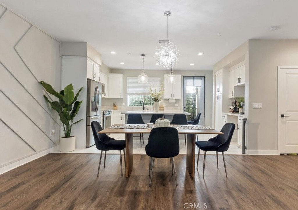 2111 Copper Walk Gardena, CA 90249 - Photo 14 of 33 a view of a dining room with furniture window and wooden floor
