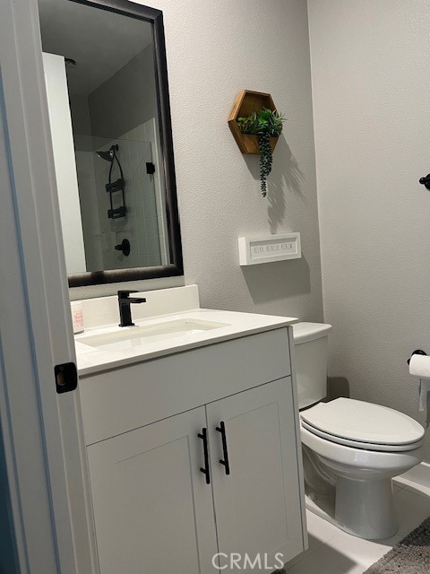 2111 Copper Walk Gardena, CA 90249 - Photo 20 of 33 a bathroom with a toilet sink and mirror