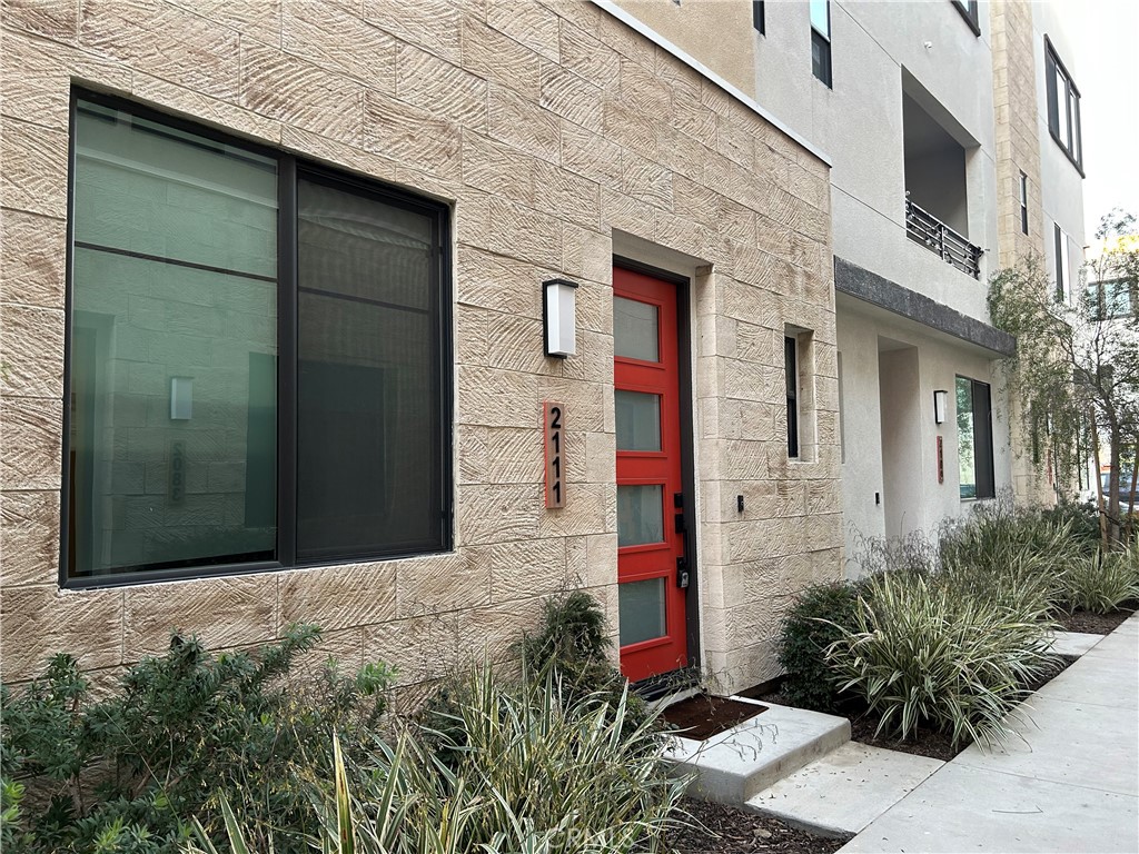 2111 Copper Walk Gardena, CA 90249 - Photo 2 of 33 a front view of a house with a yard