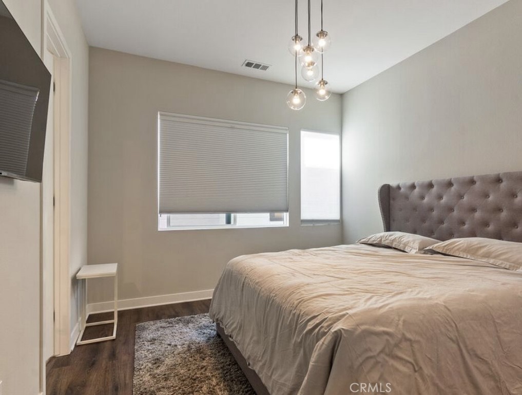 2111 Copper Walk Gardena, CA 90249 - Photo 21 of 33 a bedroom with a bed and a chair