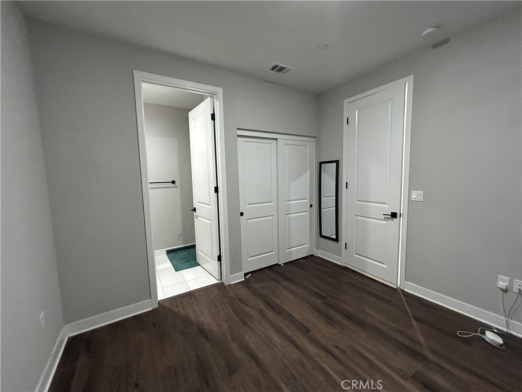 2111 Copper Walk Gardena, CA 90249 - Photo 5 of 33 an empty room with wooden floor