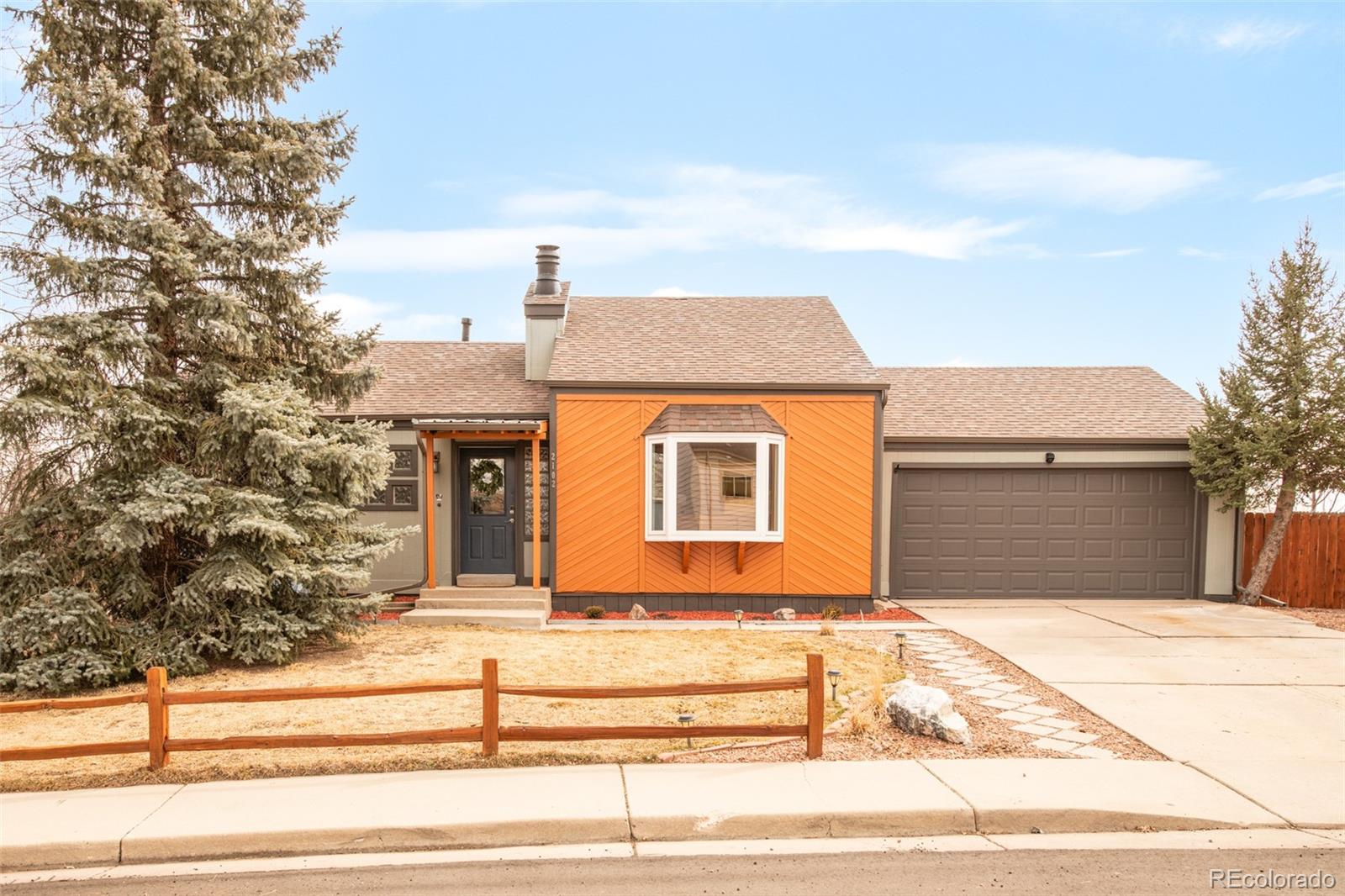 a front view of a house with garage