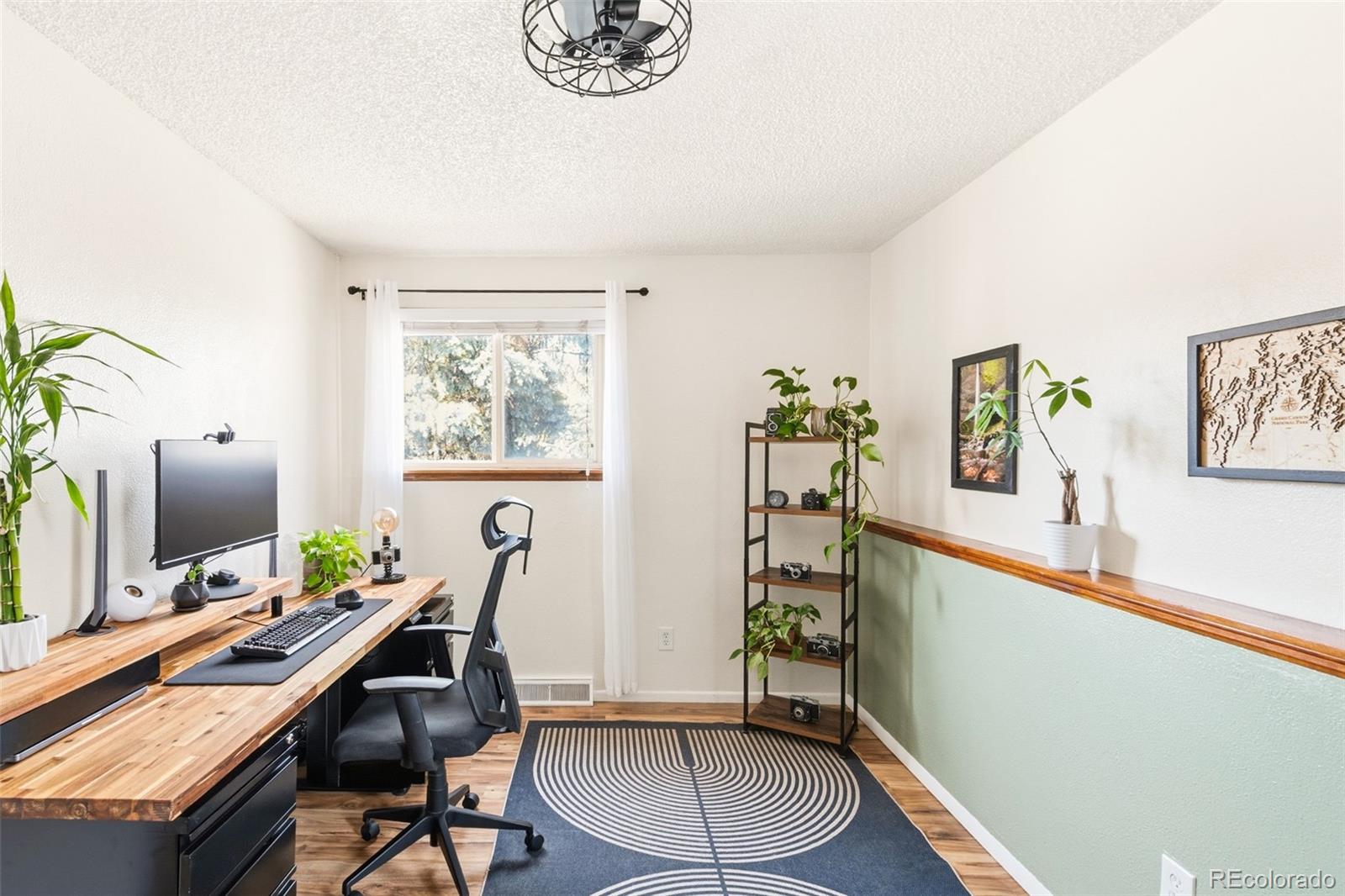 2102 Ridge Drive Broomfield, CO 80020 - Photo 13 of 35 a view of a workspace with furniture and a window
