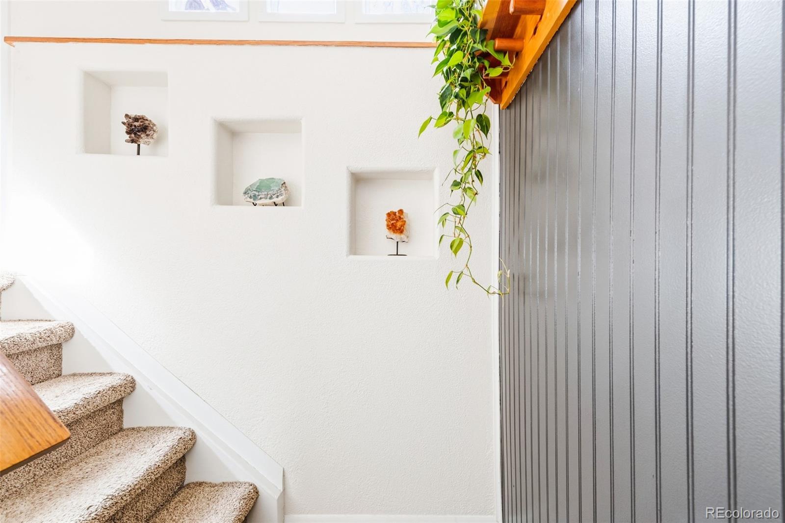 2102 Ridge Drive Broomfield, CO 80020 - Photo 17 of 35 a hallway with a couch and a potted plant