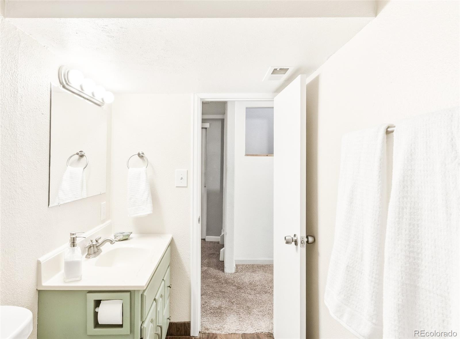 2102 Ridge Drive Broomfield, CO 80020 - Photo 22 of 35 a bathroom with a sink and a mirror