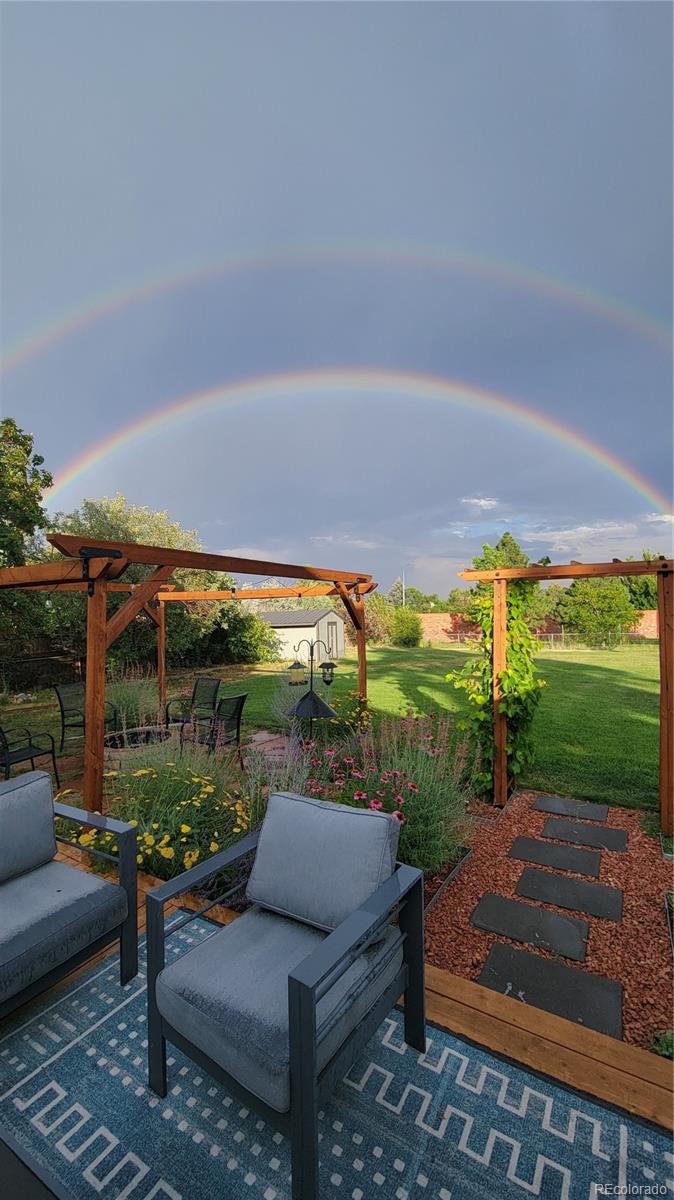 2102 Ridge Drive Broomfield, CO 80020 - Photo 30 of 35 a backyard of a house with outdoor seating