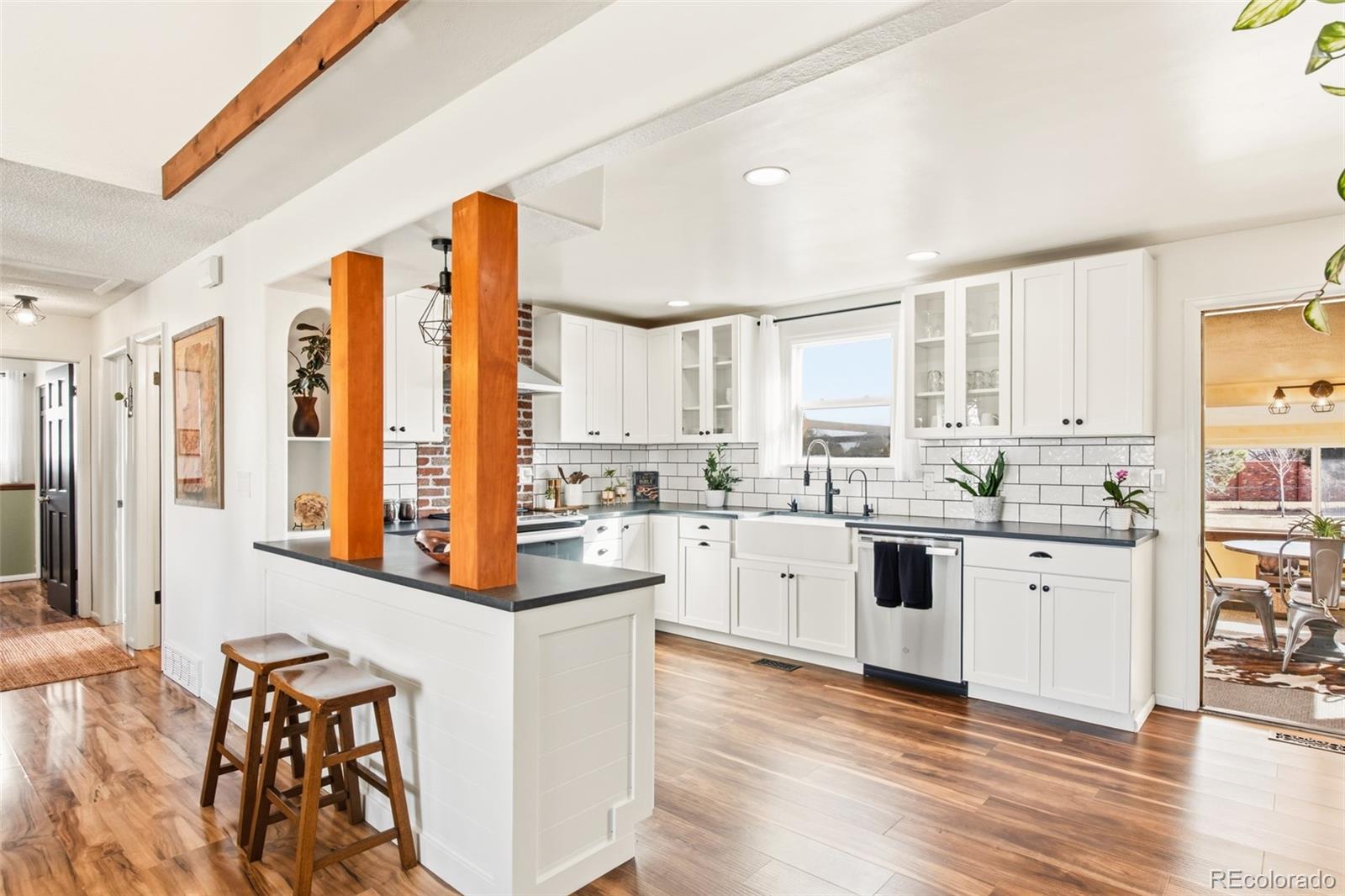 2102 Ridge Drive Broomfield, CO 80020 - Photo 6 of 35 a kitchen with stainless steel appliances granite countertop a stove and a refrigerator