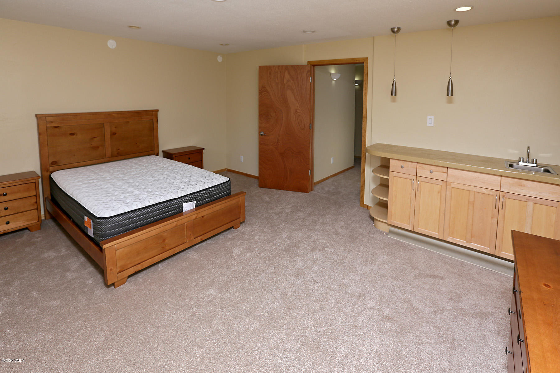 54 Columbine Circle, Unit A5 Eagle-Vail, CO 81620 - Photo 17 of 23 a bedroom with a bed and cabinets