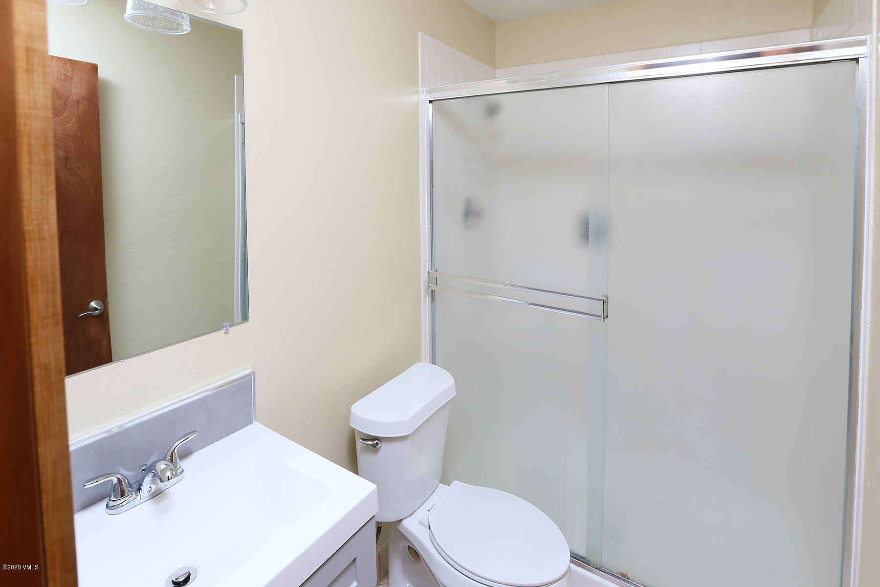 54 Columbine Circle, Unit A5 Eagle-Vail, CO 81620 - Photo 18 of 23 a white toilet sitting next to a bathroom sink