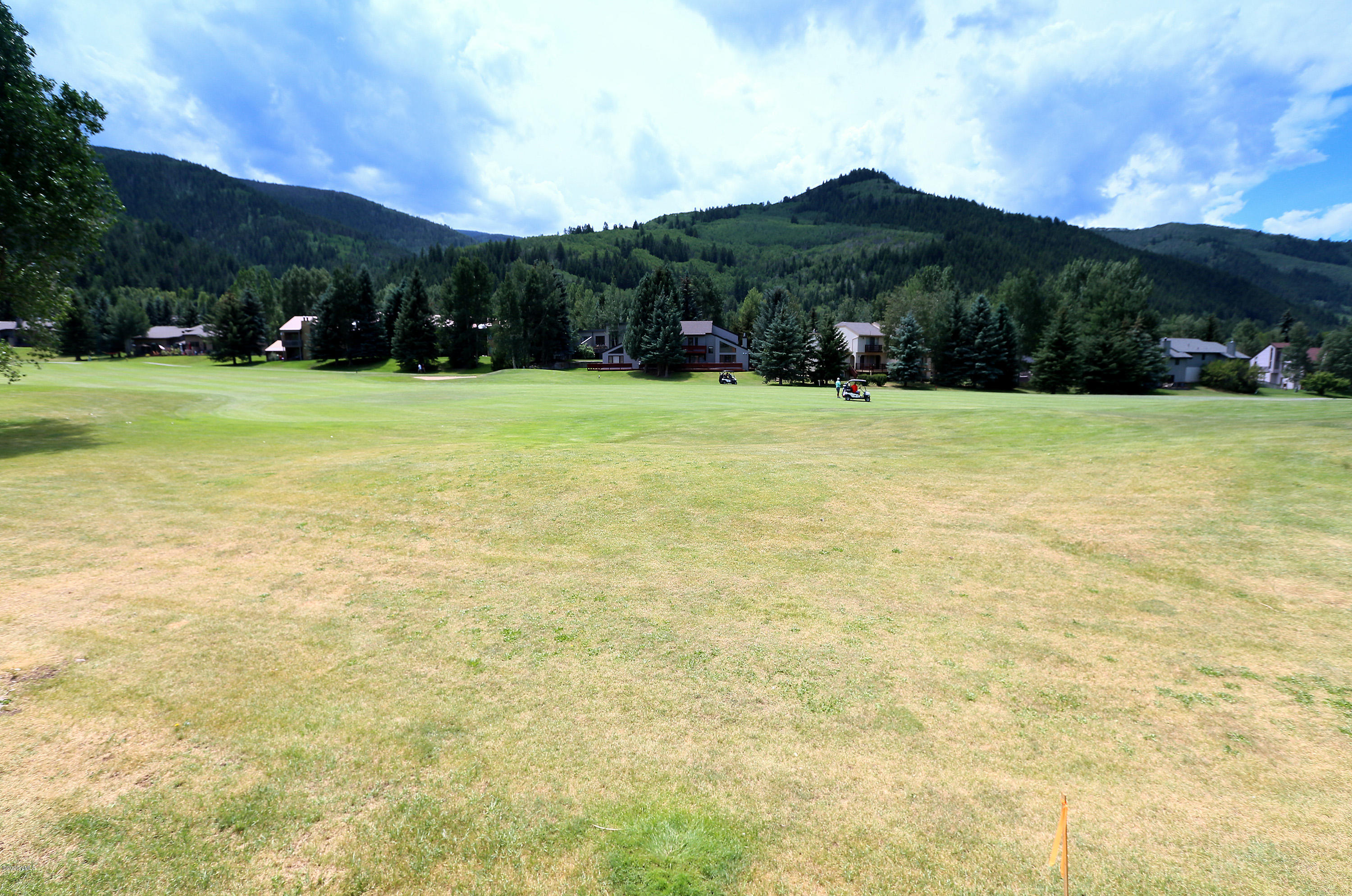 54 Columbine Circle, Unit A5 Eagle-Vail, CO 81620 - Photo 21 of 23 a view of swimming pool with a yard and green space