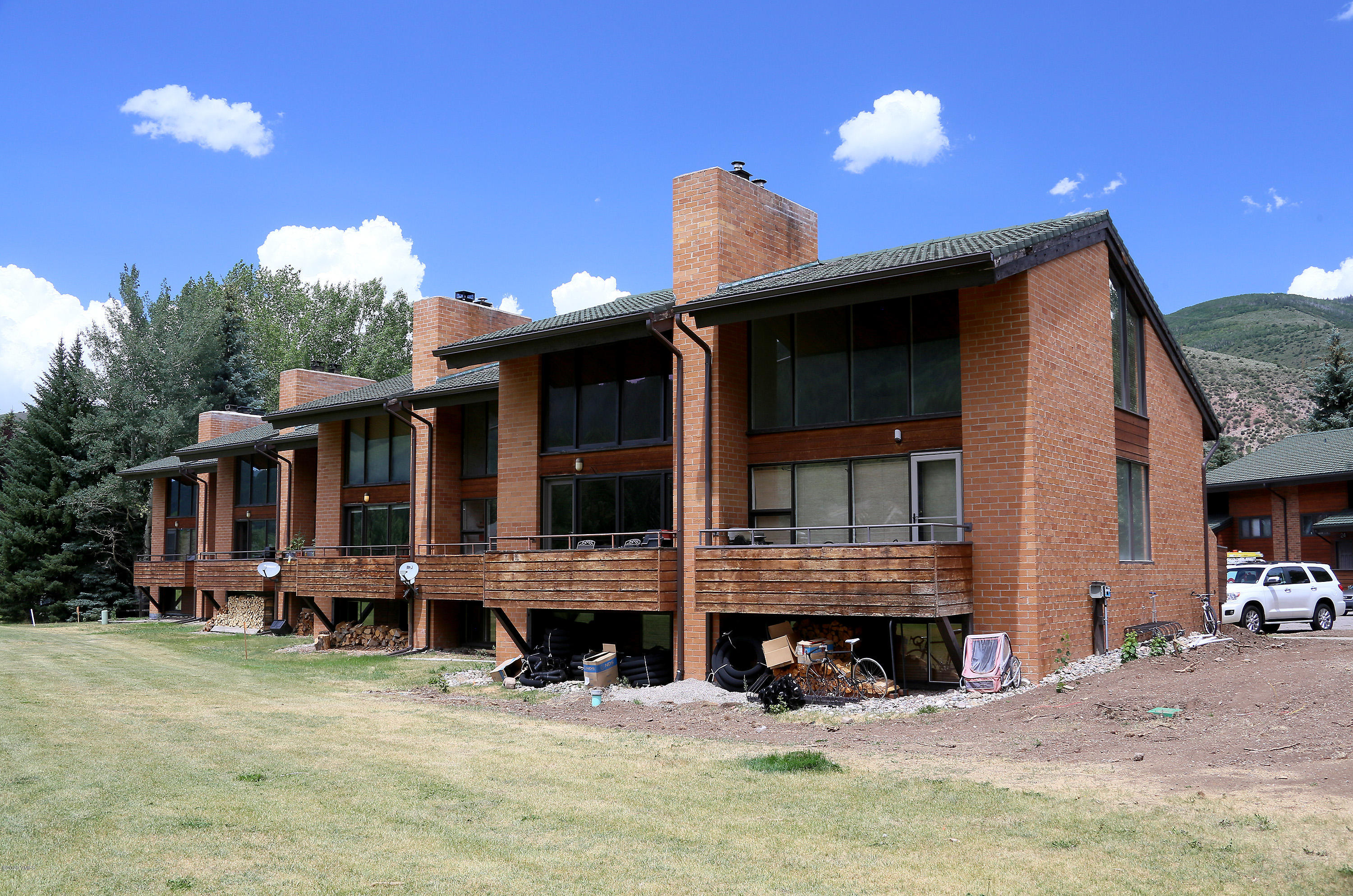 54 Columbine Circle, Unit A5 Eagle-Vail, CO 81620 - Photo 23 of 23 a view of a house with a yard in the background