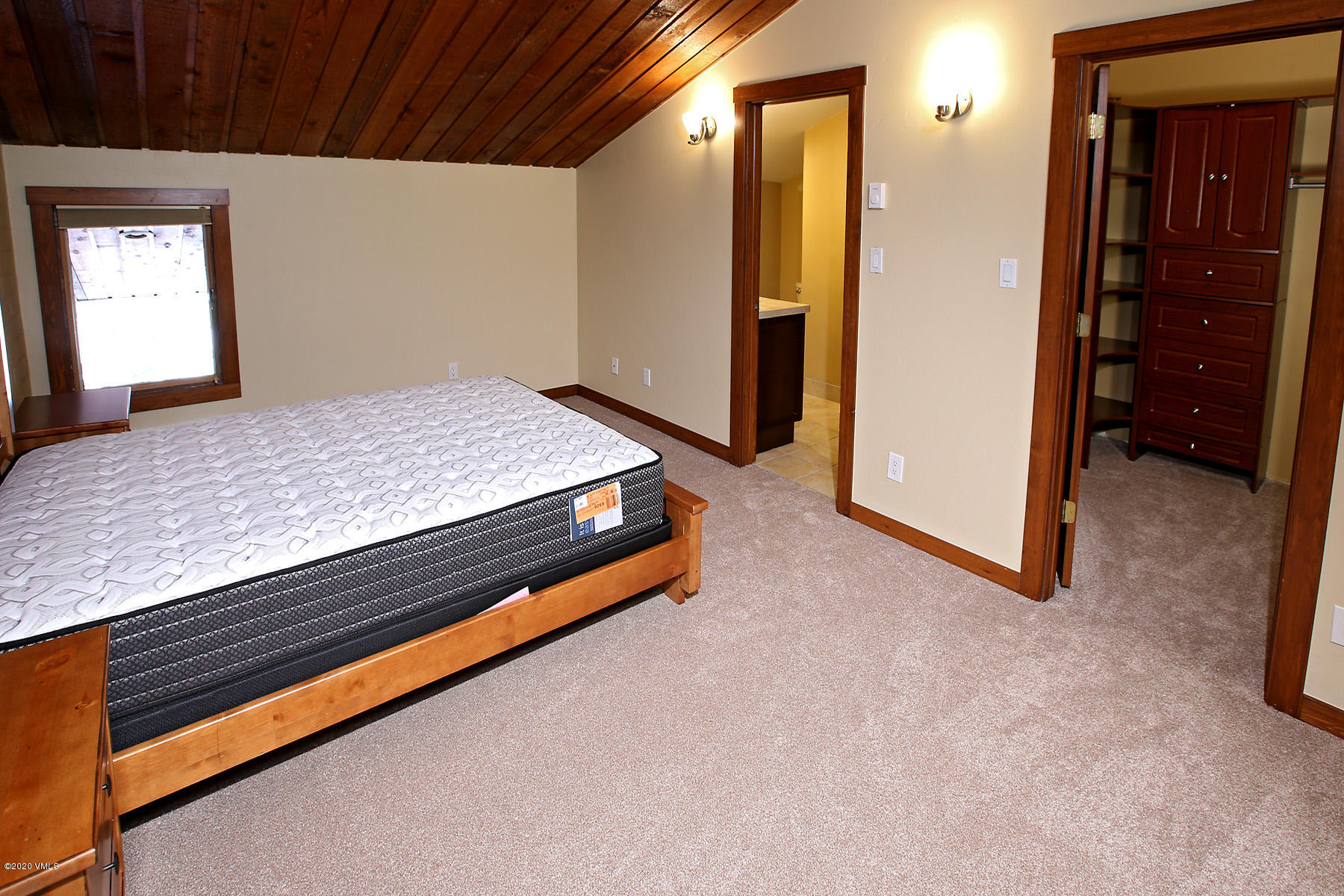 54 Columbine Circle, Unit A5 Eagle-Vail, CO 81620 - Photo 9 of 23 a bed room with a bed and dresser