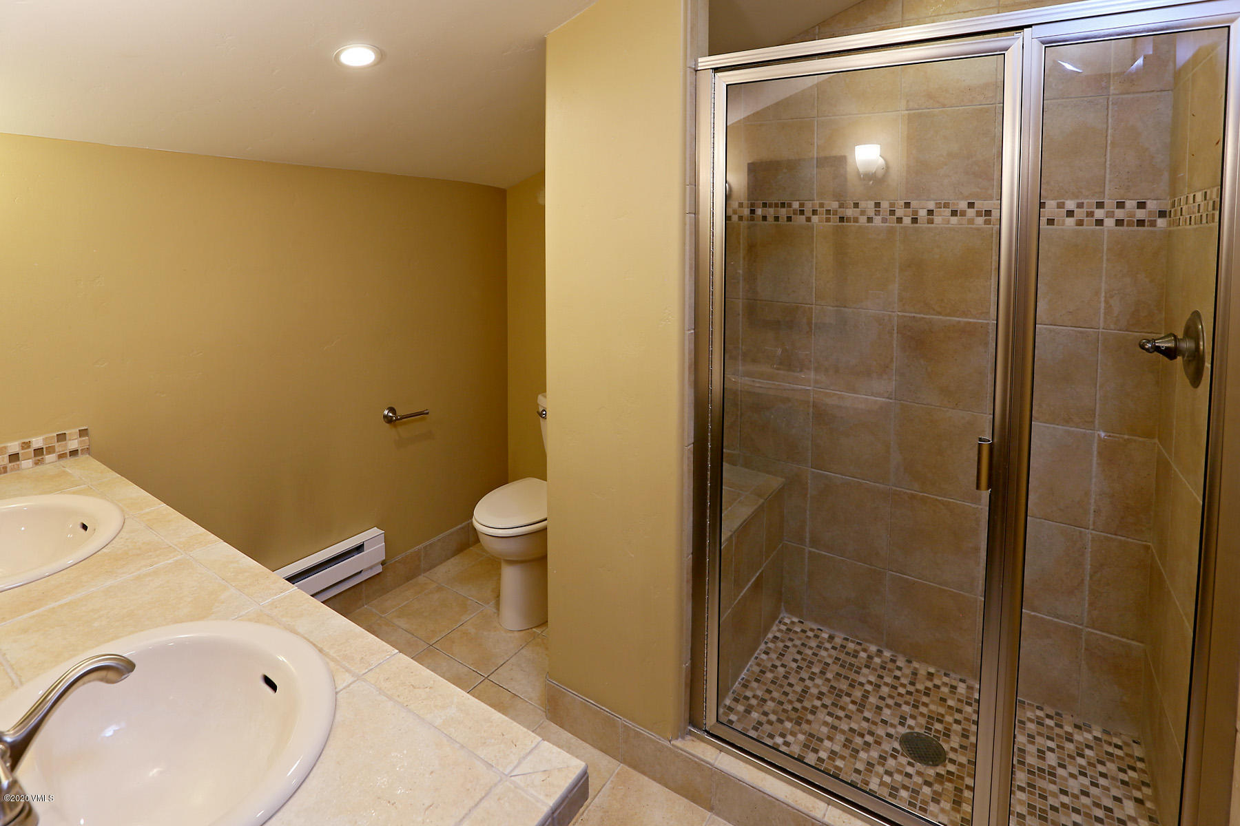 54 Columbine Circle, Unit A5 Eagle-Vail, CO 81620 - Photo 10 of 23 a bathroom with a sink and a shower
