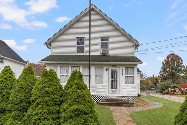 a front view of a house with a yard