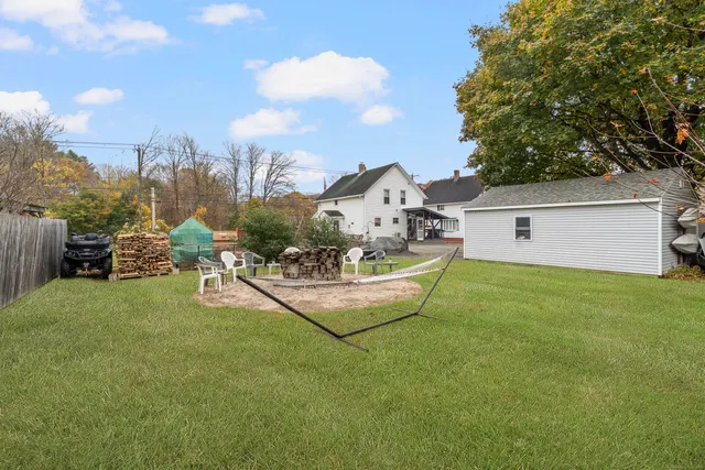 a view of a backyard with sitting area
