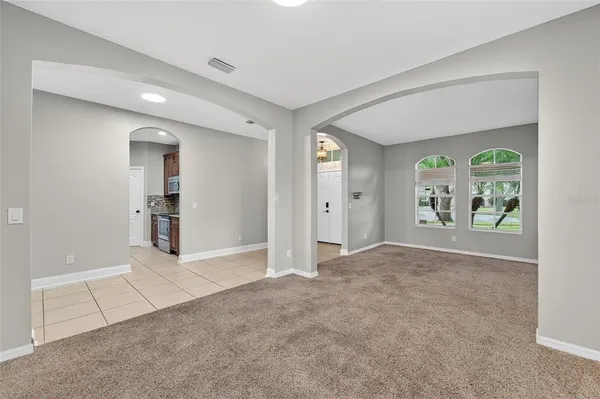 a kitchen with stainless steel appliances granite countertop a sink and a stove