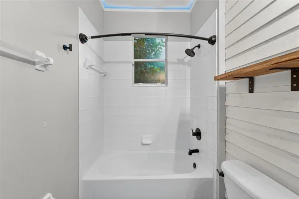 a view of a backyard with table and chairs