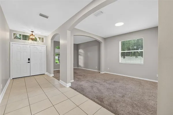 a view of kitchen with stainless steel appliances granite countertop a refrigerator and a sink