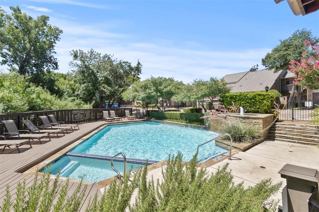 a view of a swimming pool with a patio