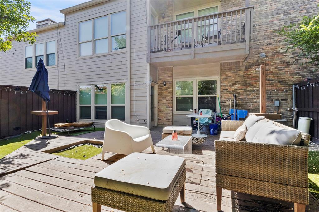 5616 Preston Oaks Road, Unit 1105 Dallas, TX 75254 - Photo 15 of 17 a view of a patio with couches chairs and wooden floor
