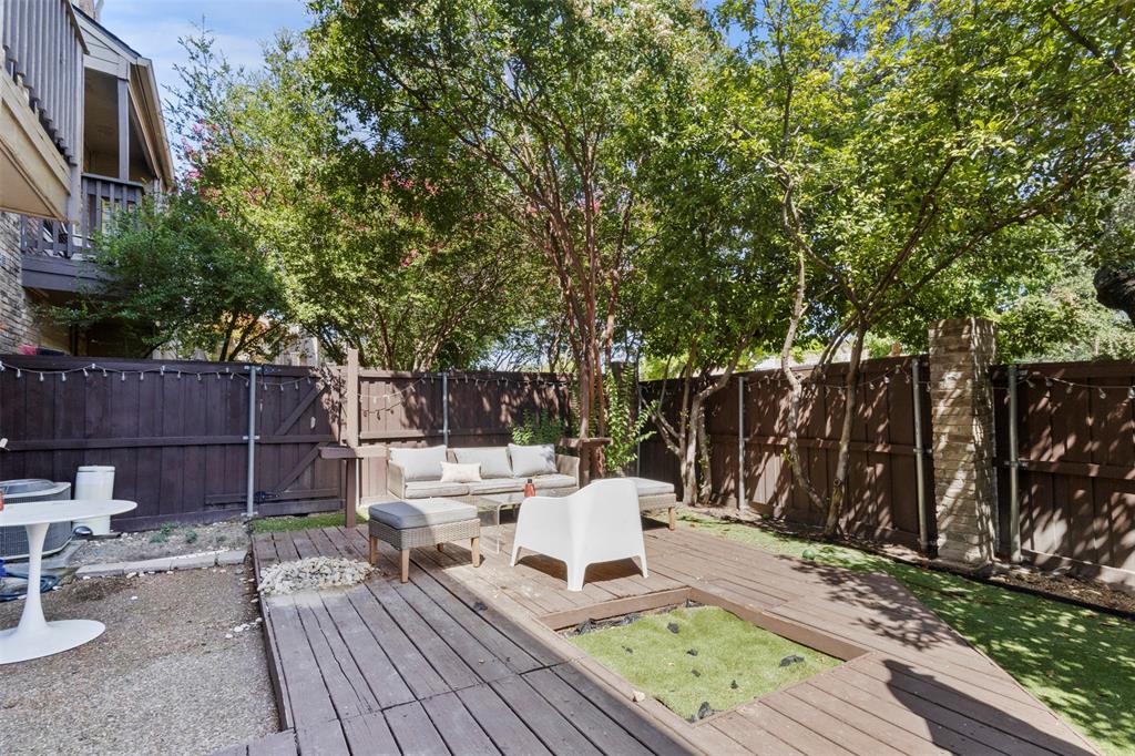 5616 Preston Oaks Road, Unit 1105 Dallas, TX 75254 - Photo 16 of 17 a view of a deck with furniture and wooden fence