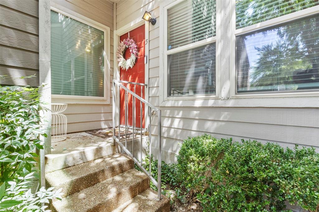 5616 Preston Oaks Road, Unit 1105 Dallas, TX 75254 - Photo 2 of 17 a front view of a house with a yard