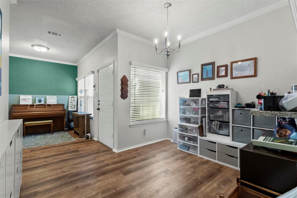 5616 Preston Oaks Road, Unit 1105 Dallas, TX 75254 - Photo 7 of 17 a bedroom with furniture and a window