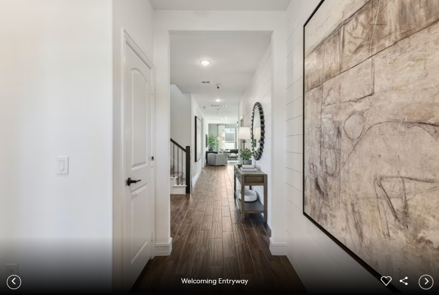 312 Celeste Way Liberty Hill, TX 78642 - Photo 4 of 15 a view of a hallway with wooden floor windows and a living room