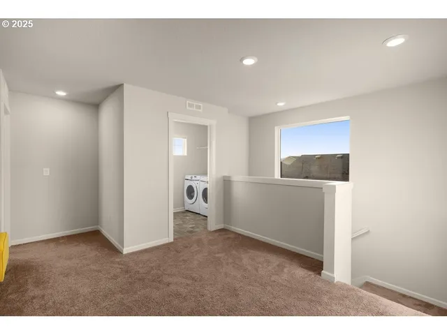 a view of hallway with wooden floor