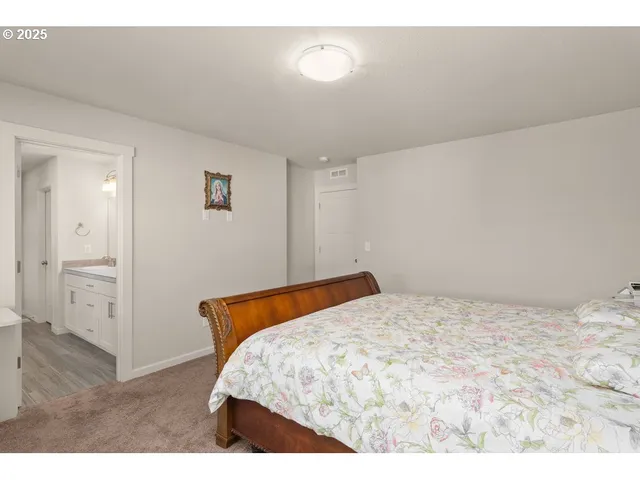 a bedroom with a bed and a cabinets