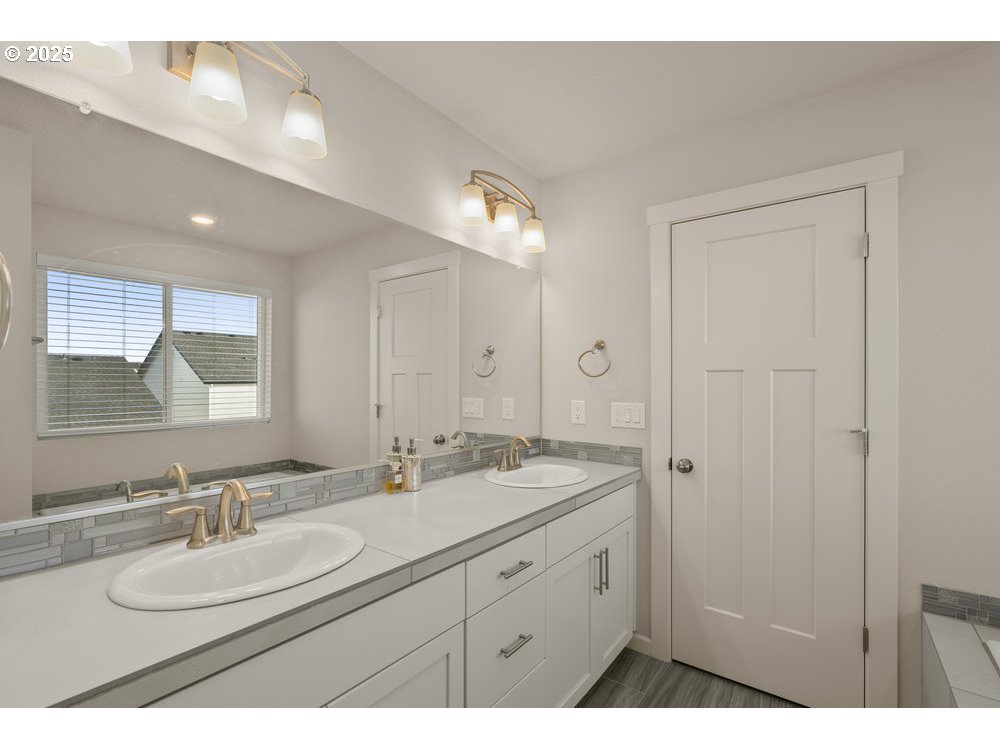 6421 Southeast 22nd Street Gresham, OR 97080 - Photo 23 of 39 a bathroom with a sink double vanity and a mirror