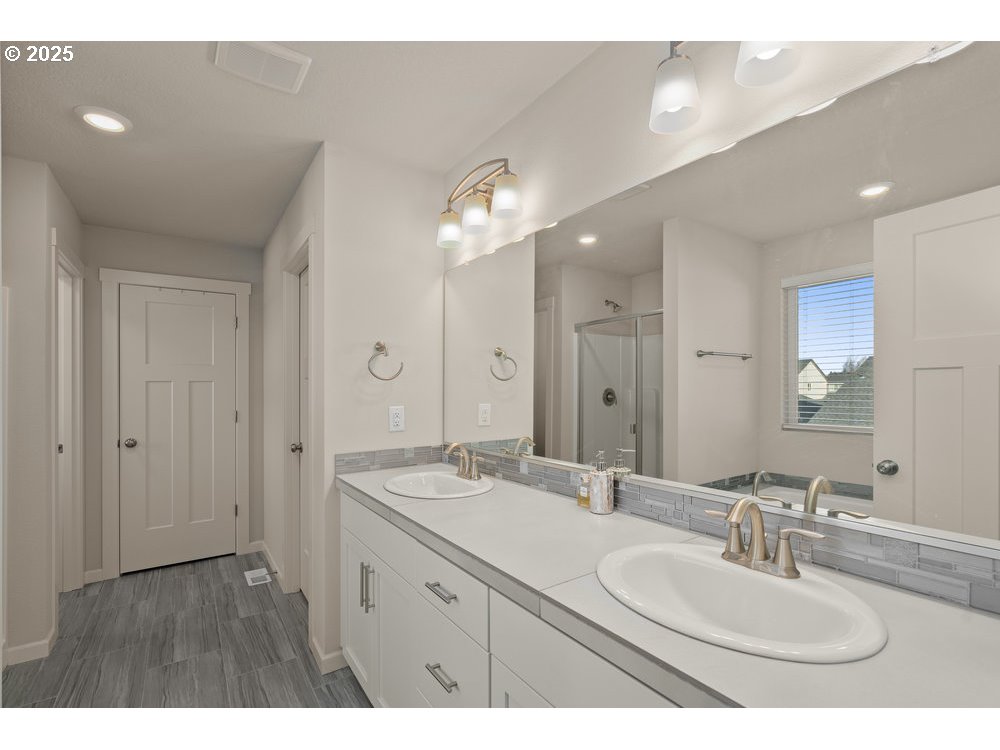 6421 Southeast 22nd Street Gresham, OR 97080 - Photo 24 of 39 a bathroom with a double vanity sink mirror and double