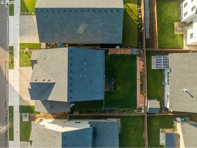 an aerial view of a house with a ocean view