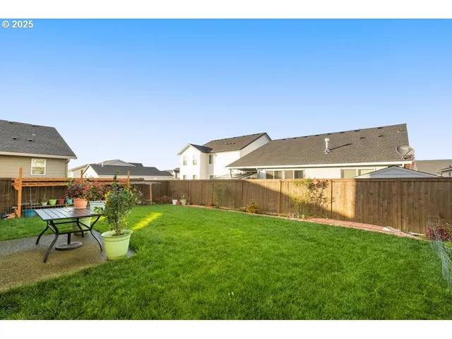 a view of backyard with seating area