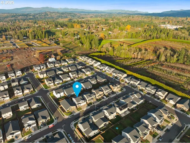 an aerial view of residential building and ocean view