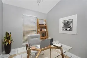 a work room with furniture and flowers