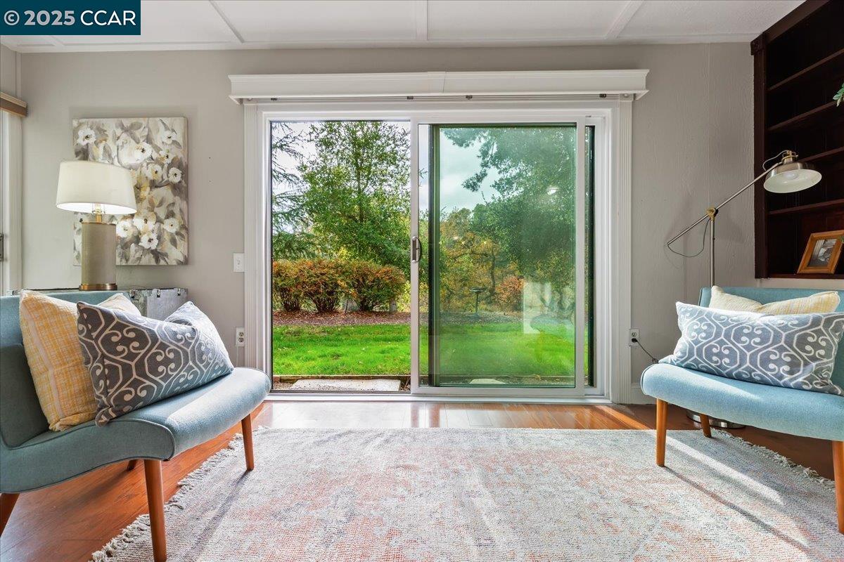 1857 Golden Rain Road, Unit 2 Walnut Creek, CA 94595 - Photo 12 of 39 a living room with couch and a window