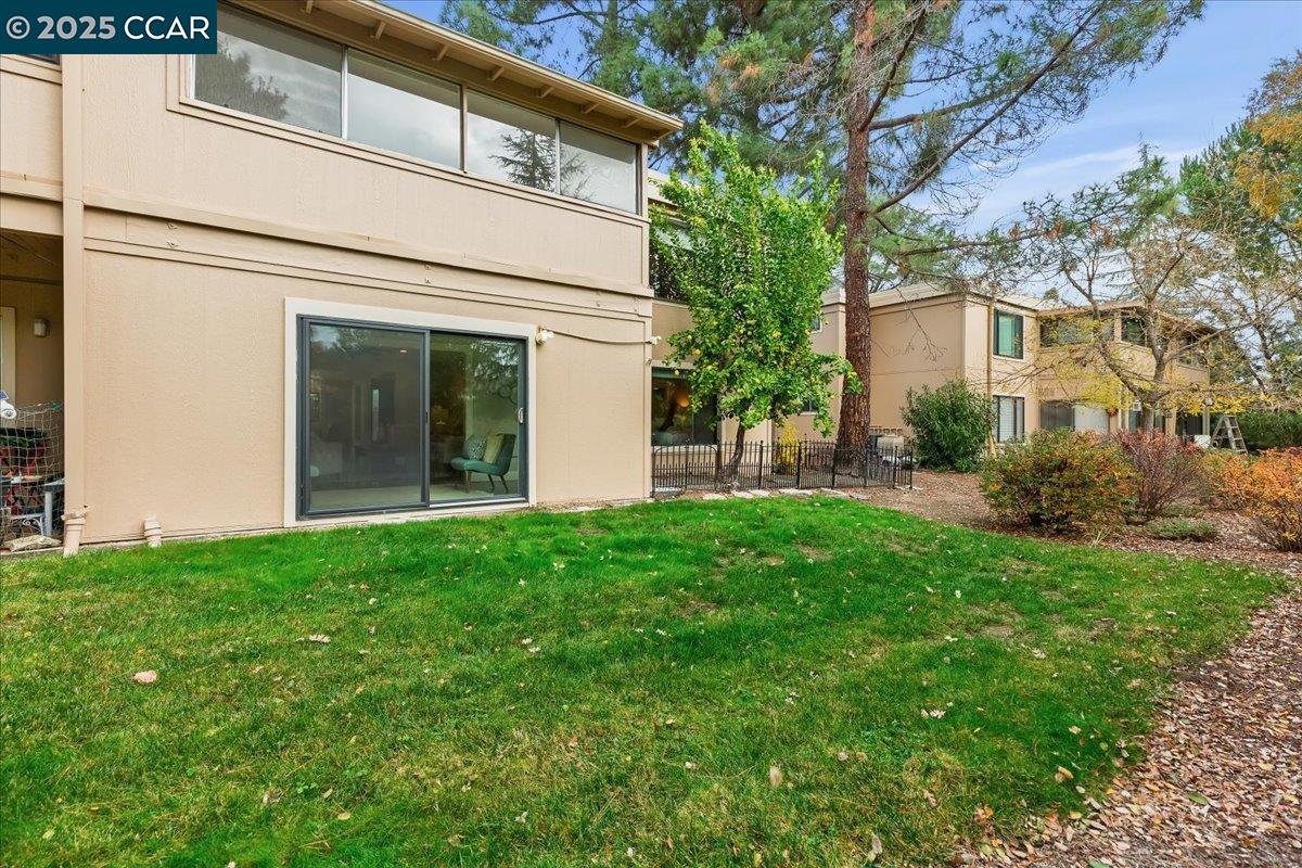 1857 Golden Rain Road, Unit 2 Walnut Creek, CA 94595 - Photo 14 of 39 a view of a backyard with plants and large tree