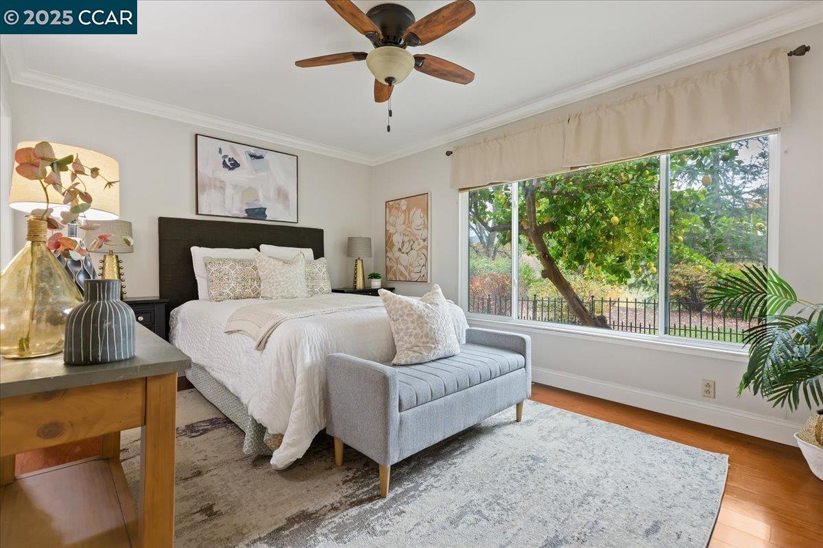 1857 Golden Rain Road, Unit 2 Walnut Creek, CA 94595 - Photo 22 of 39 a bedroom with a bed and a large window