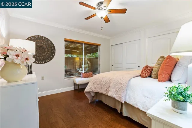 a bed room with a bed and a chandelier