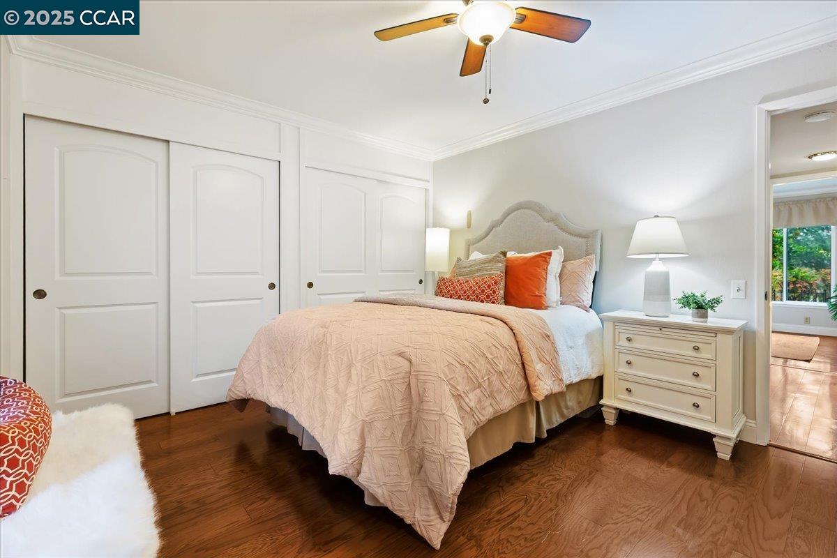 1857 Golden Rain Road, Unit 2 Walnut Creek, CA 94595 - Photo 28 of 39 a bed room with a bed and a chandelier