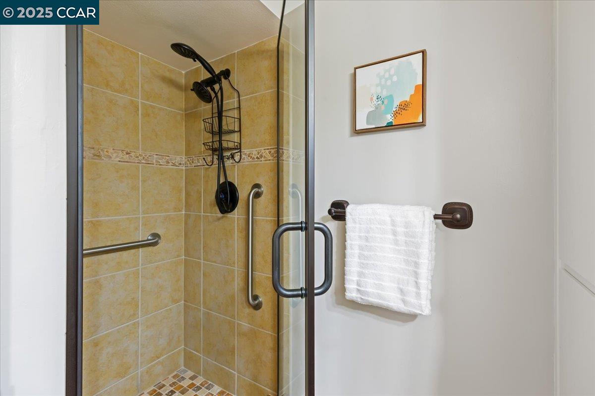 1857 Golden Rain Road, Unit 2 Walnut Creek, CA 94595 - Photo 30 of 39 a bathroom with a shower