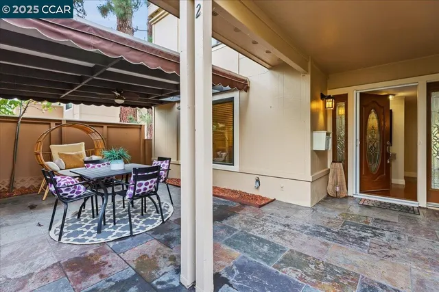 a view of outdoor space with table and chairs