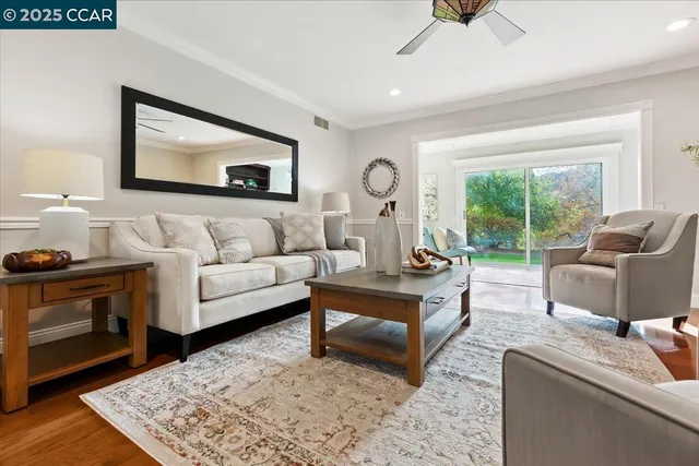 a living room with furniture and a rug