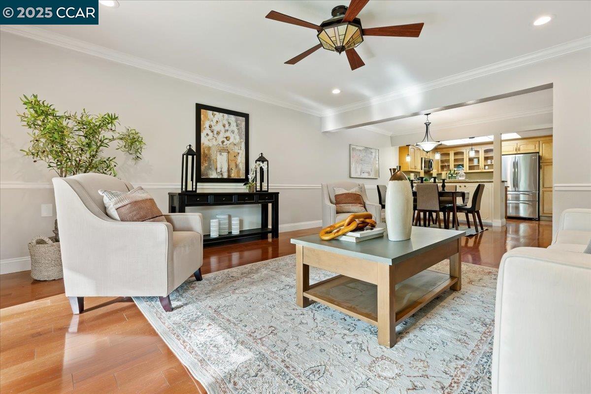 1857 Golden Rain Road, Unit 2 Walnut Creek, CA 94595 - Photo 10 of 39 a living room with furniture and wooden floor