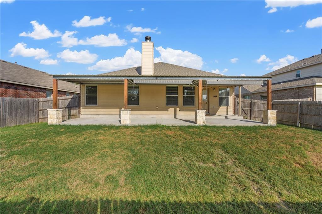 20224 Merlin Falcon Trail Pflugerville, TX 78660 - Photo 36 of 40 A spacious, private backyard with a covered patio for outdoor enjoyment.