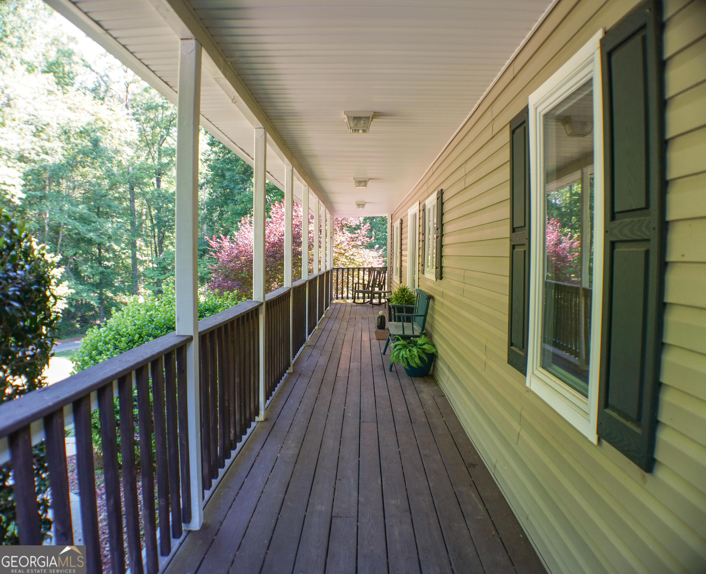 335 Winding Stream Trail Hampton, GA 30228 - Photo 3 of 35 a view of a balcony with wooden floor